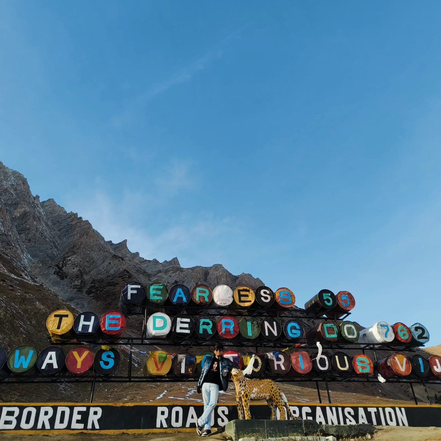 'fearless, the derring-do' — border roads sign in kashmir, featuring one very cold me